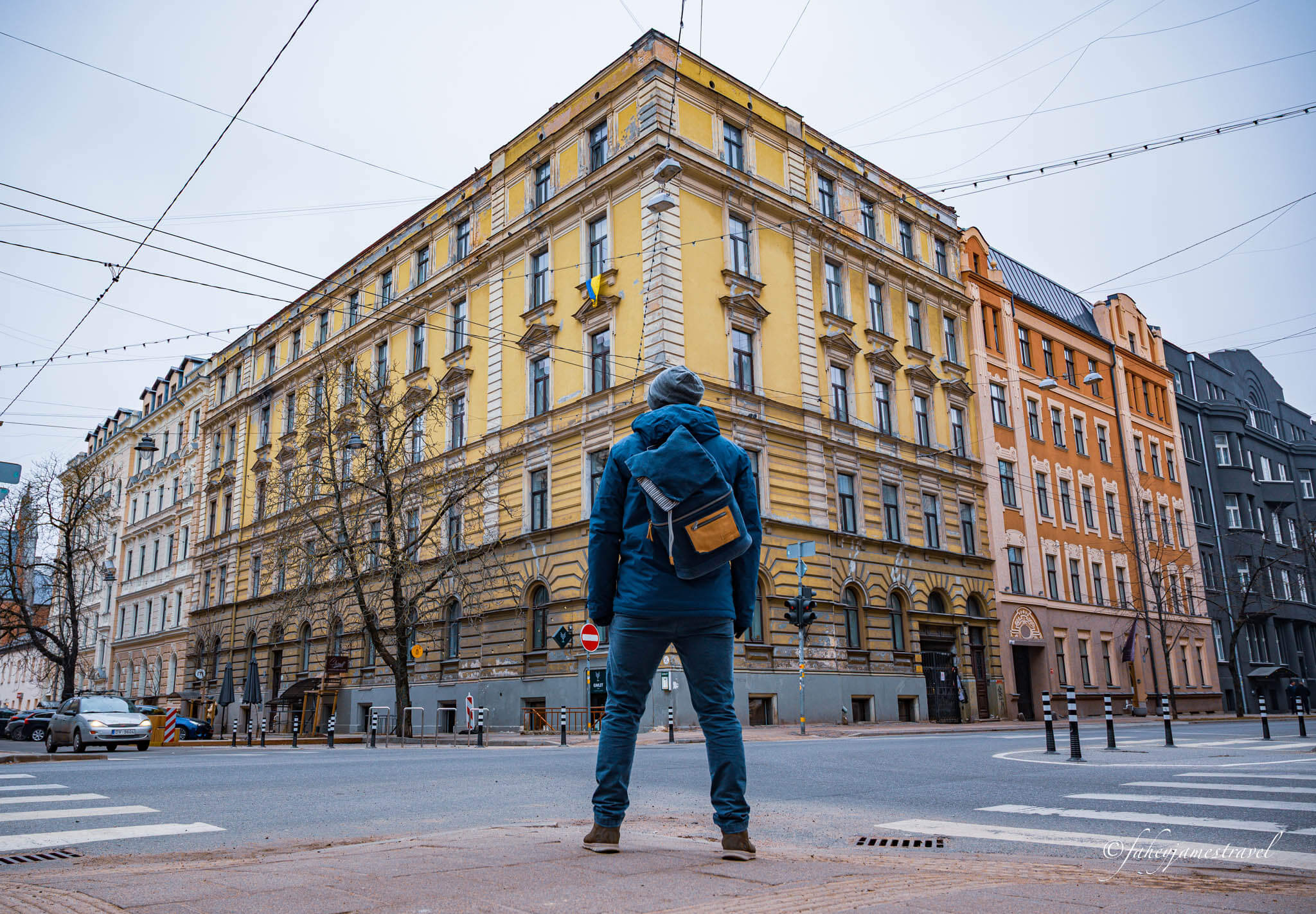 james standing at a crossroads in riga Latvia