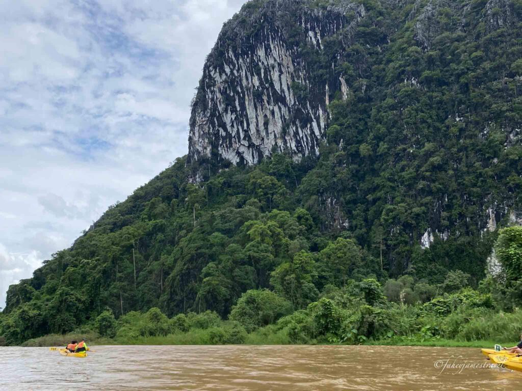 limestone cliff on the bank of the river in vang vieng is a great thing to do there