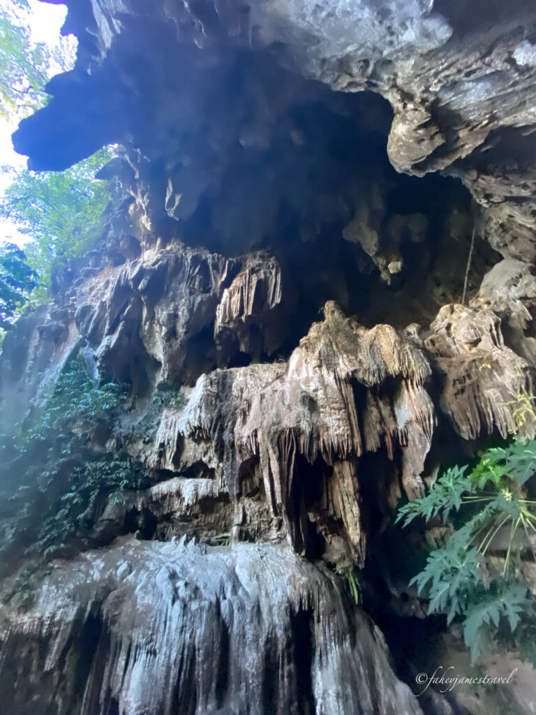 Looking up at the stalagmites at Phakounham Cave and Viewpoint, the cave is large, and it looks very big compared to the entrance