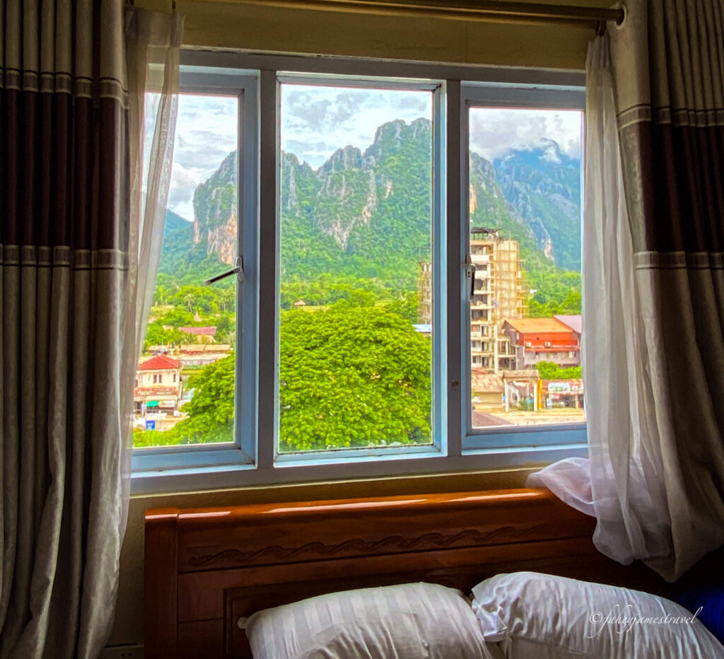 a window view from the Annecy hotel shows the limestone formations out in the background