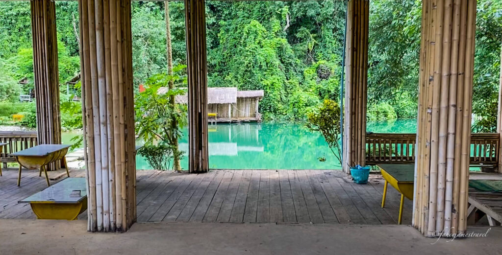 Blue Lagoon 6 in Vang Vieng is one of the best things to do. Inside the restaurant, which is shown as abandoned, the walkway leads out to the green and blue lagoon