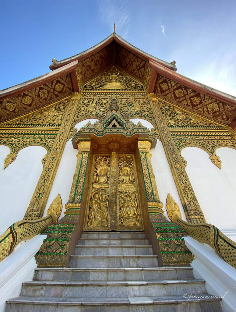 Haw Pha Bang luang prabang temple has amazing yellow and green detail in the door