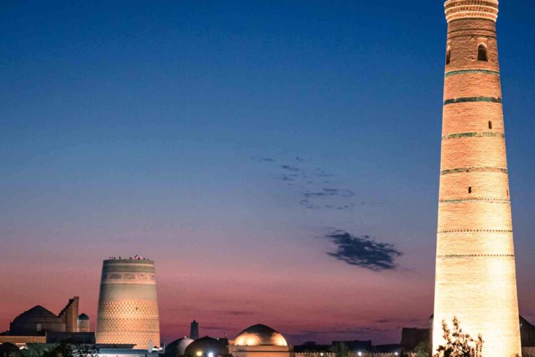khiva skyline at night as the sunset sets. make khiva part of your uzbekistan travel guide