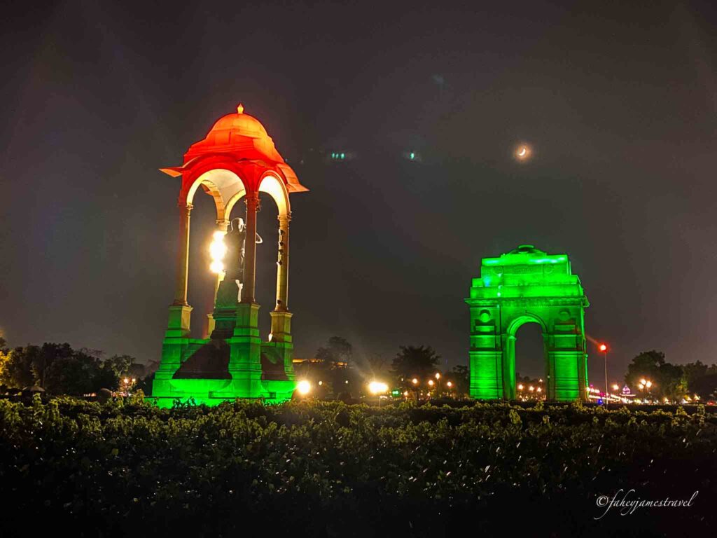 india gate is pictured on james' 3 day itinerary at night with lights