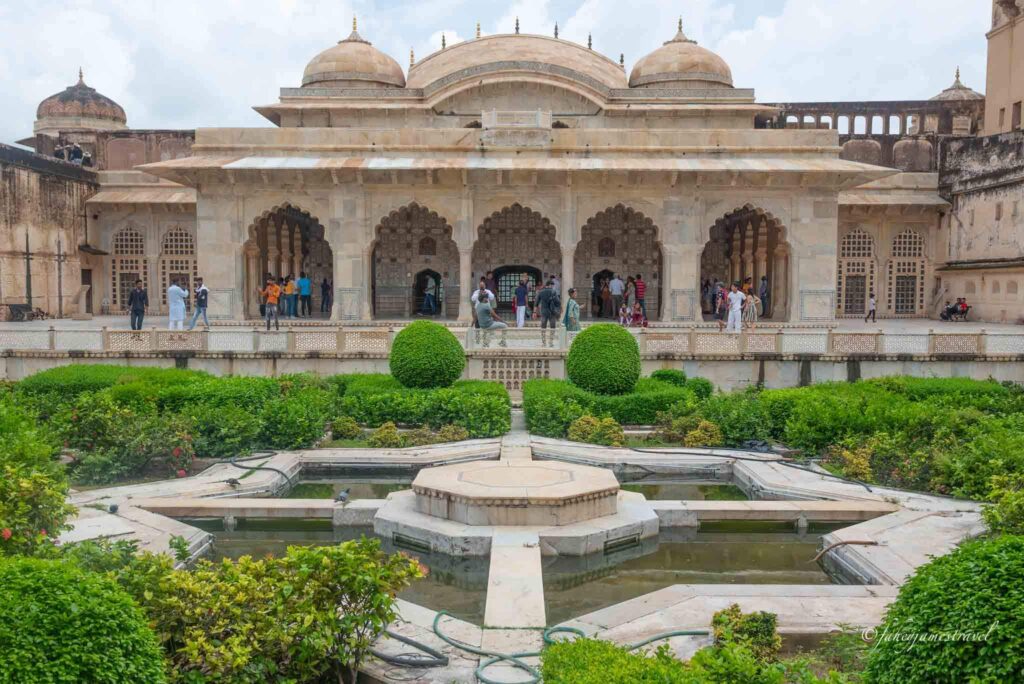 sheesh mahal is pictured with green plants in front on my 2 day jaipur itinerary