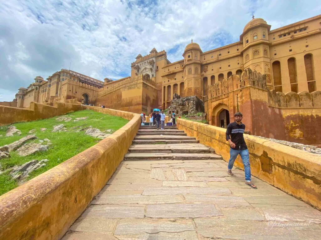 steps to amber apalce are pictured wiht other people walking part of the 2 day itinerary for jaipur