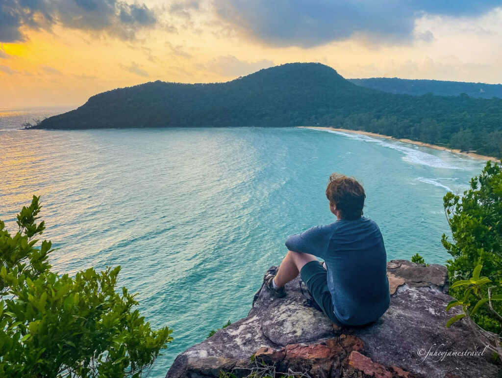 image of James Fahey at the viewpoint of lazy beach looking down on the sea