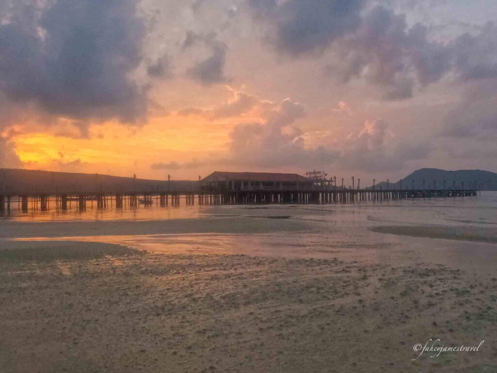 koh rong samloem saracen beach at sunset is picrured