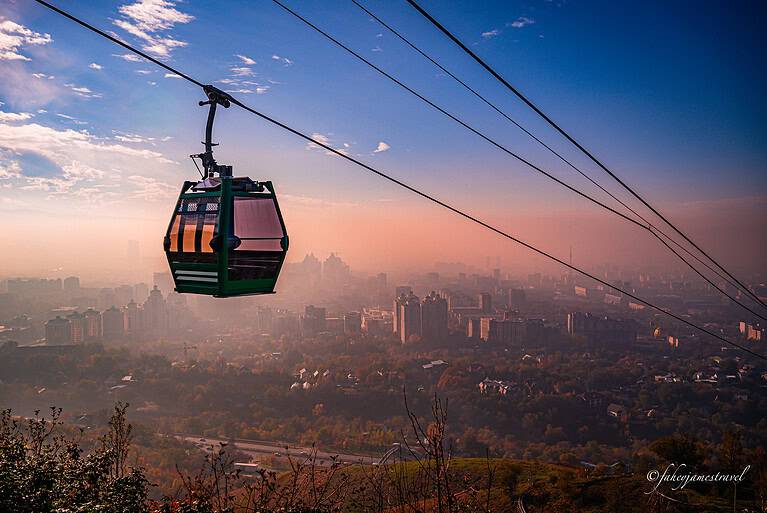 view of calamity from Kok tube. the sky is pink with a fog over the city