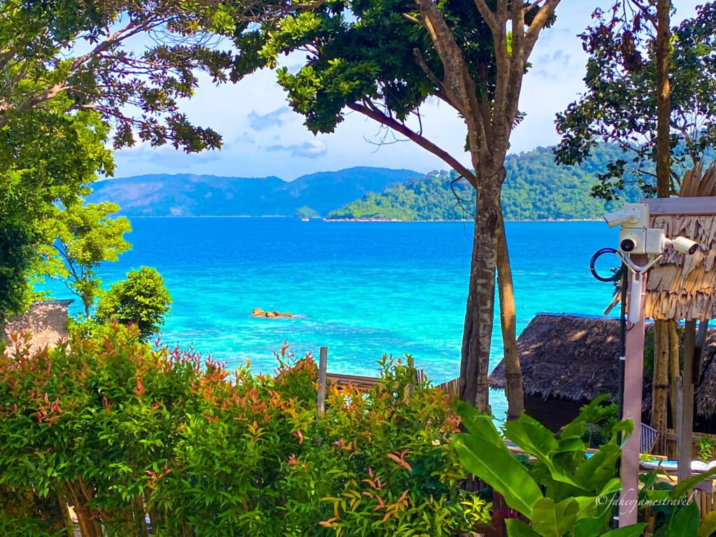 sunset beach from our hotel with amazing blue water and cloudy sky