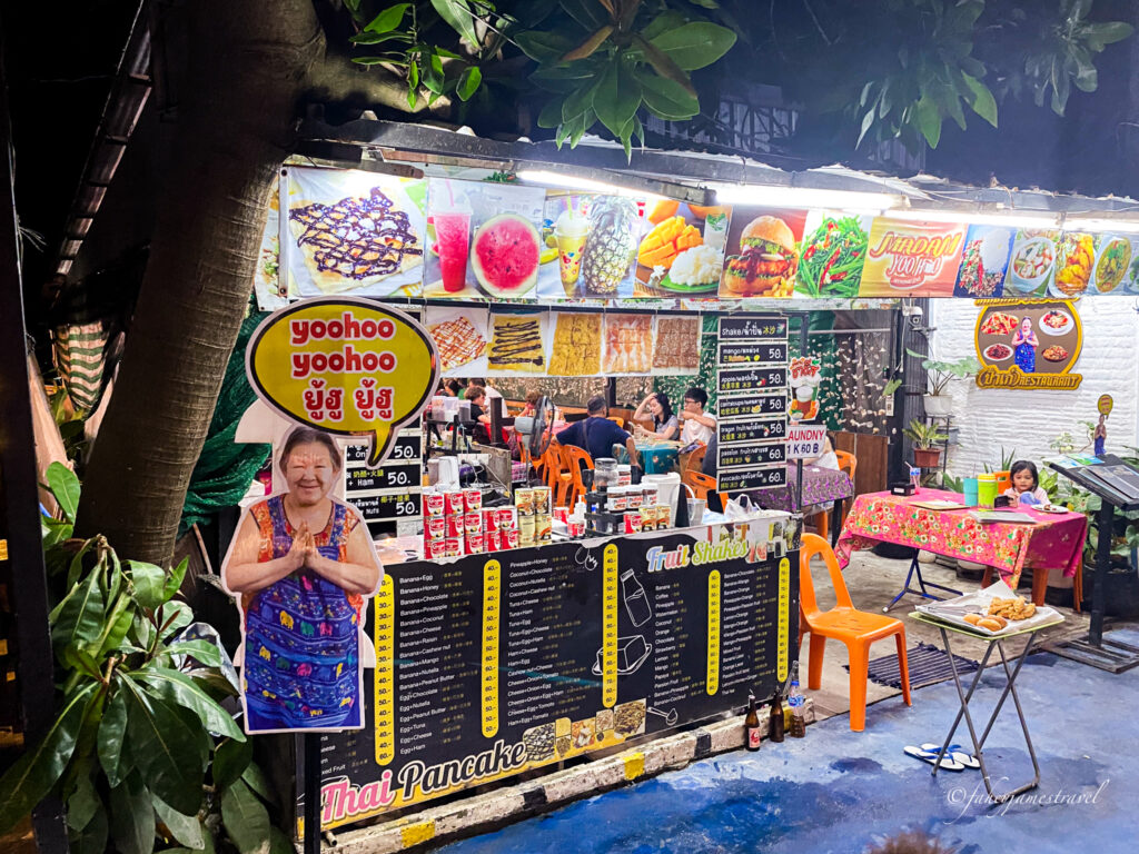 madam yoohoo advert on walking street with some customers inside