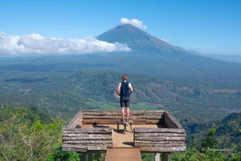 a man stands with his arms folded on the lahangan sweet platform where most people take a photo