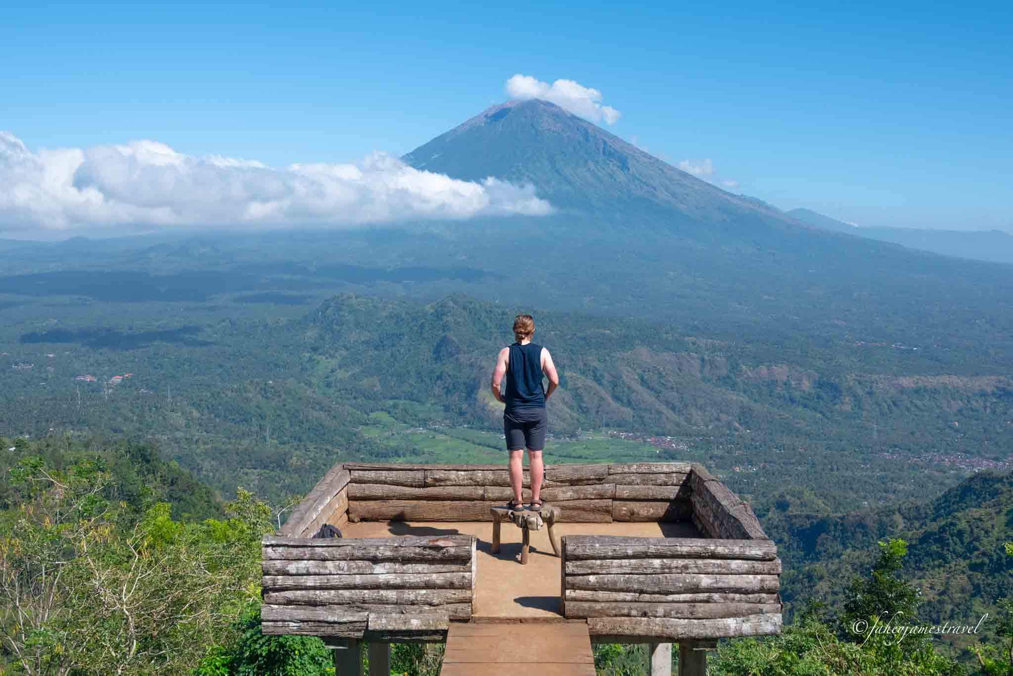 a man stands with his arms folded on the lahangan sweet platform where most people take a photo