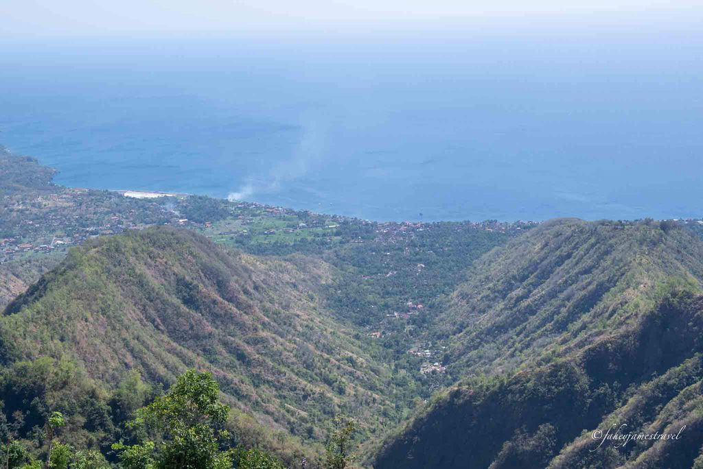 a view from lahangan sweet showing a valley leading down to the sea