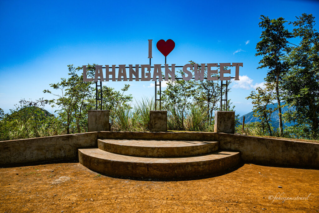 a big sign that reads lahangan sweet. there are a couple of steps where people can walk up to take a photo 