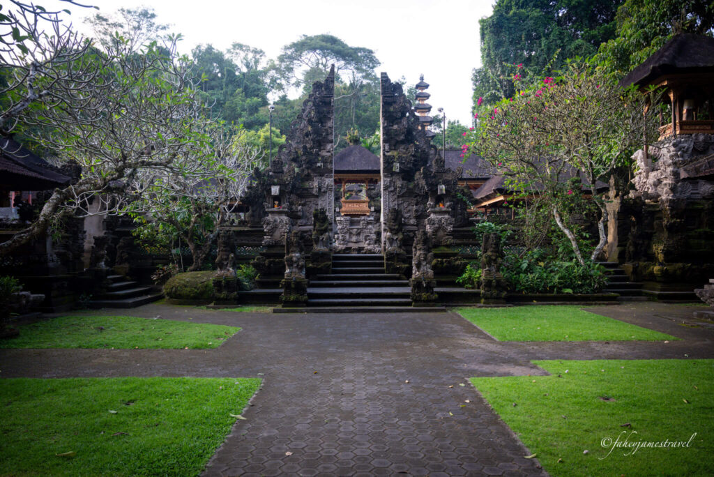 ubud palace is shown from inside the complex. the stone architecture which is typically found in bali 
