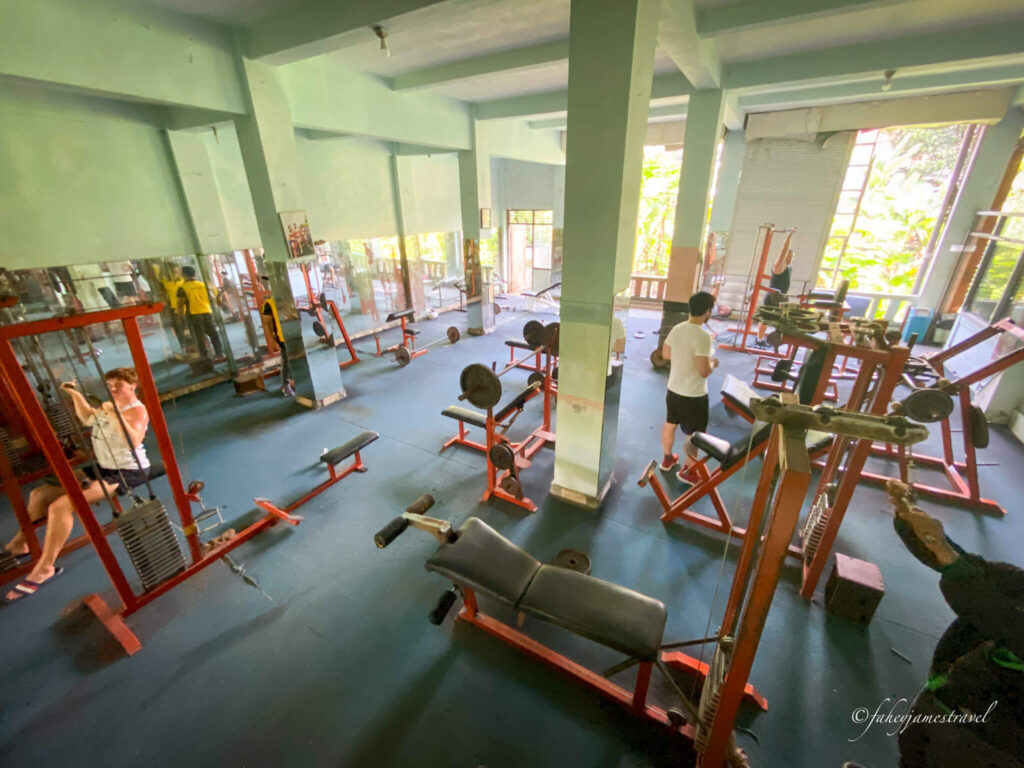 one of the gyms in ubud which is the cheapest one available is shown with red gym equipment  