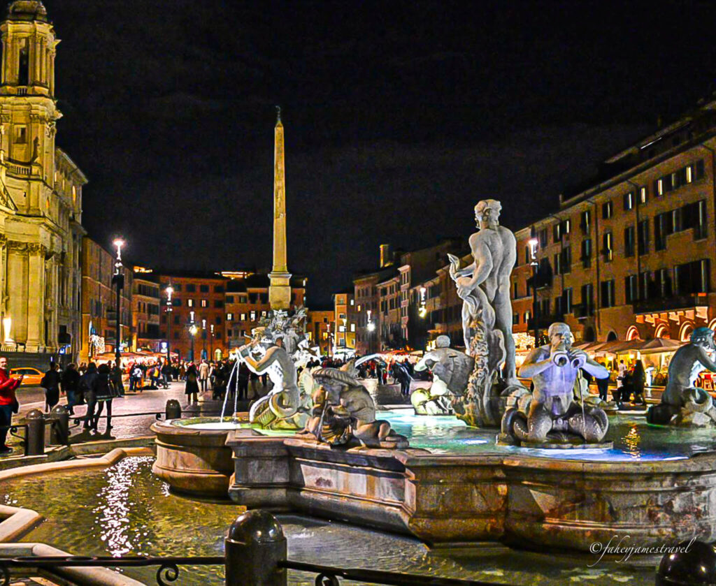 Piazza Navona at night time wioth many people in the streets