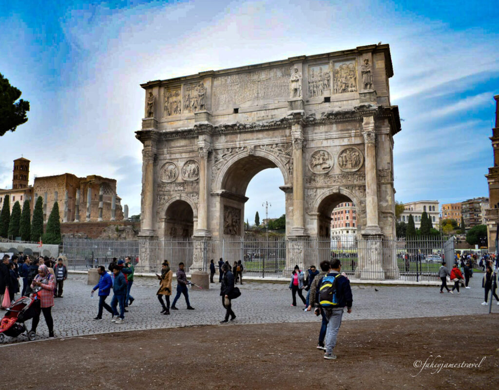 people walk outside the colosseum in rome 