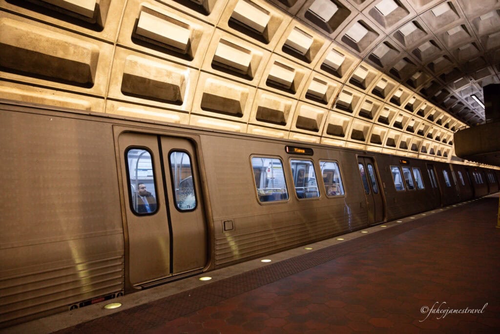 The underground metro is shown in Washington, D.C with some people inside