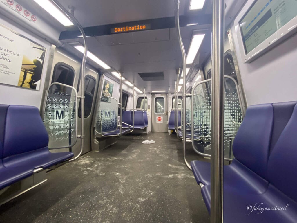 Inside the Washington DC metro is shown with no people and blue seats