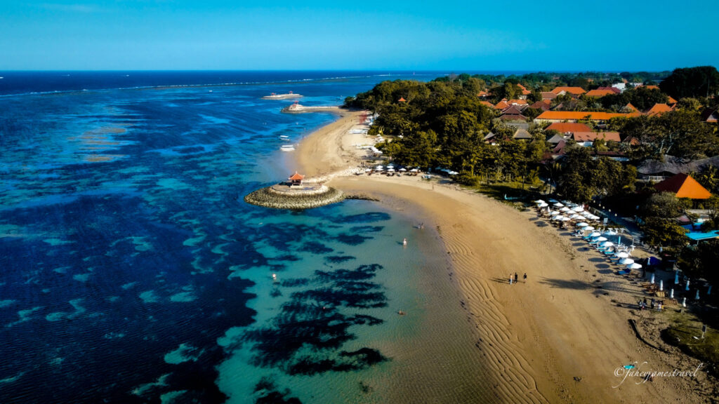 sanur beach is shown with shallow waters