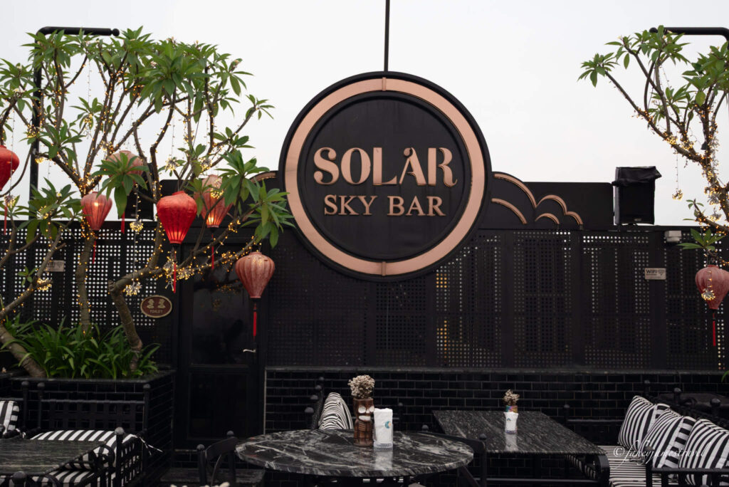 Solar Sky Bar is pictured on the rooftop wit trees and lanterns on the sides