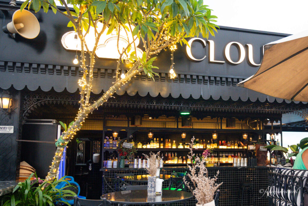 a tree with lights is pictured on the rooftop of Cloud Sky Bar Hanoi