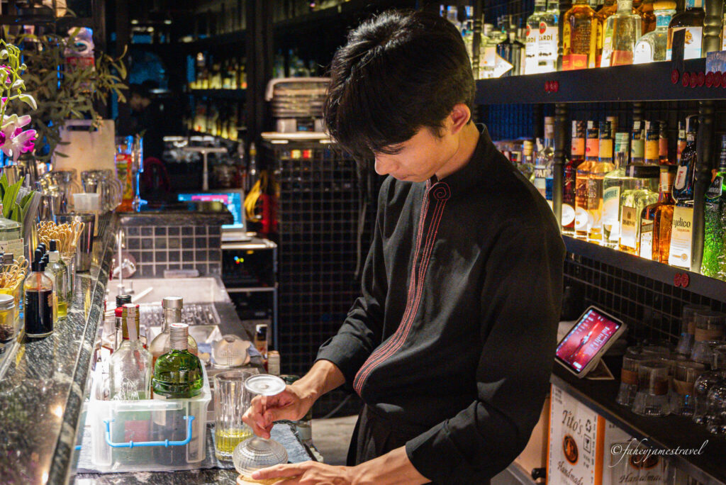 barman makes a drink at Cloud Sky Bar Hanoi