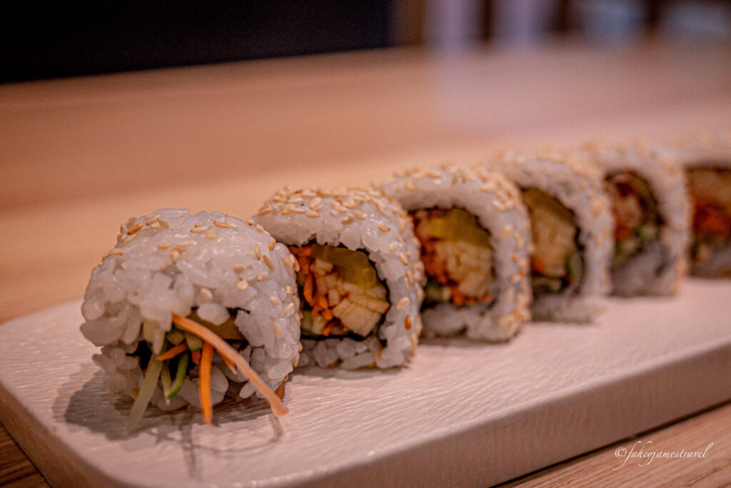 Sushi Kei Vincom Royal City shows more sushi lined up on the table
