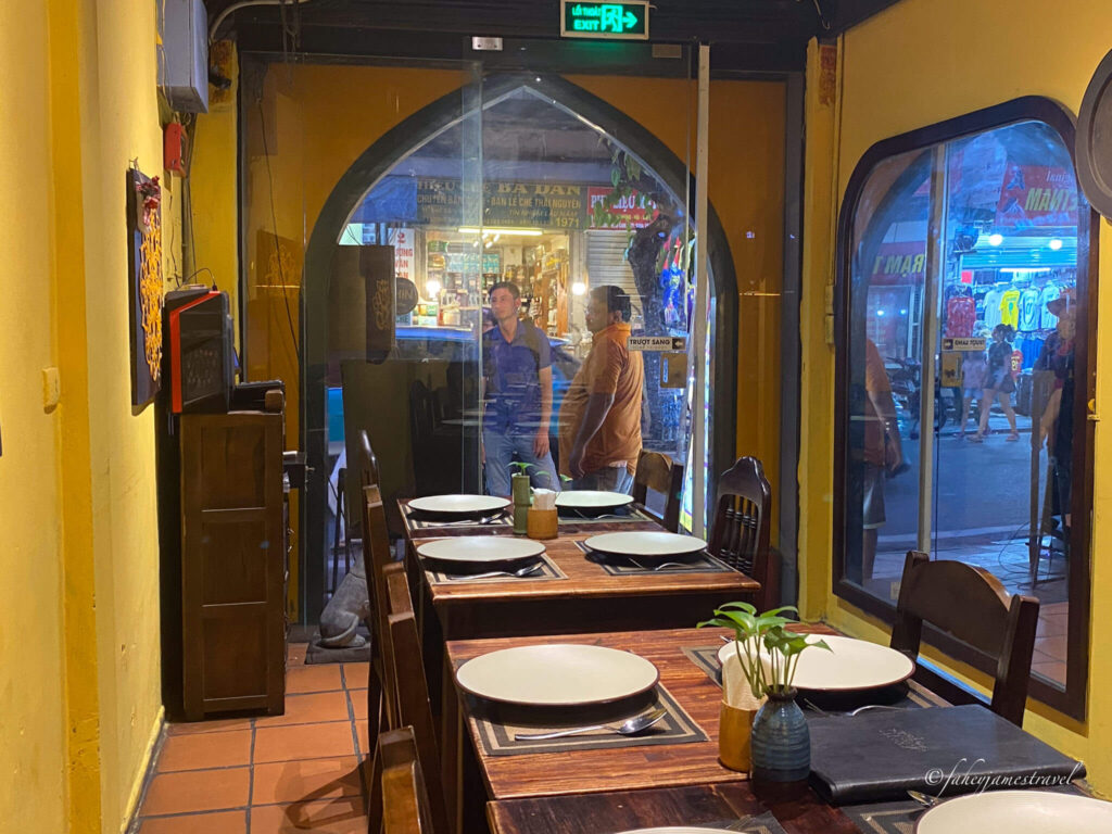 people stand outside the door of Swad Kitchen