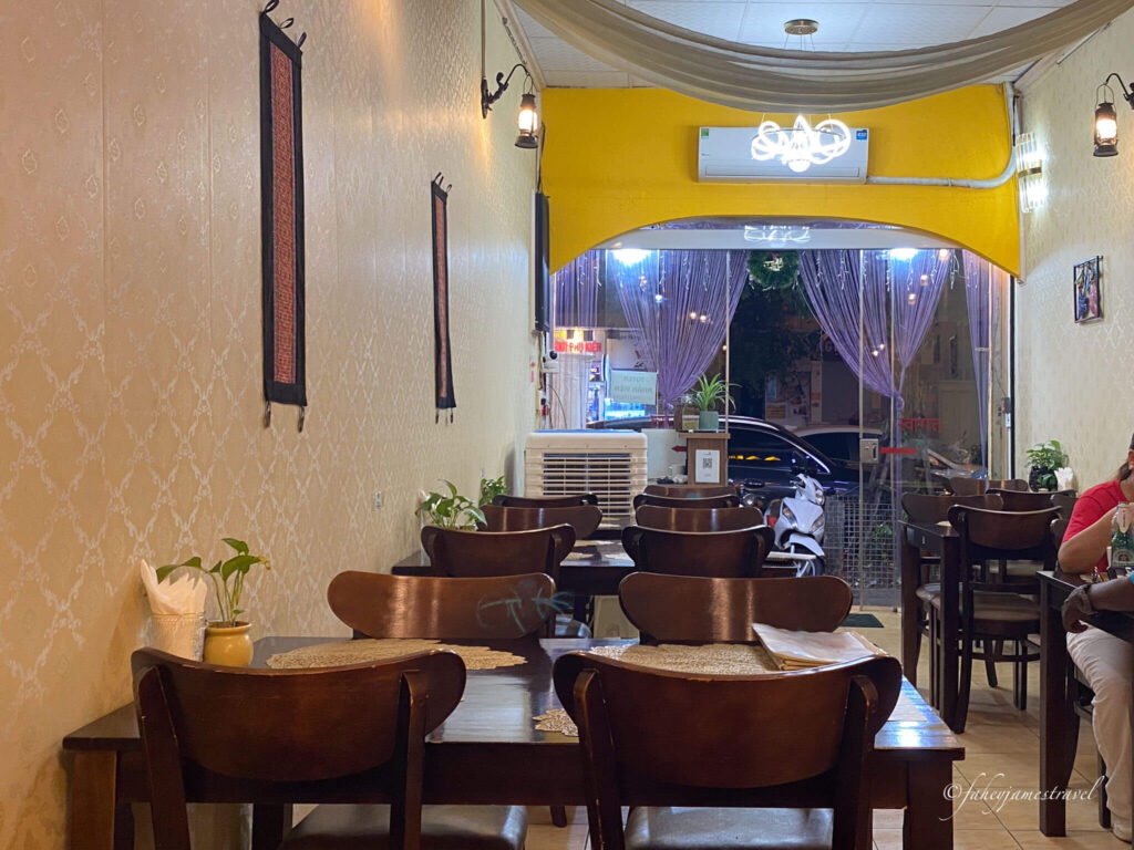 the tables and chairs inside aahar restaurants are visible 
