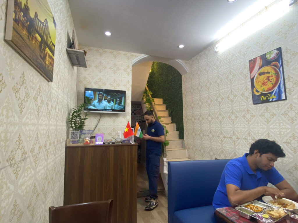 staff wait behind the counter at AMY Indian Restaurant - Pure Vegetarian & Jain Food