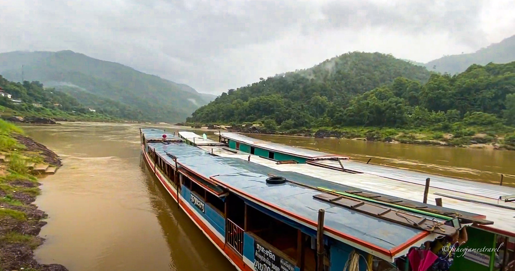 the slow bpat in laos is pictured pulled up onshore at pak neg in laos