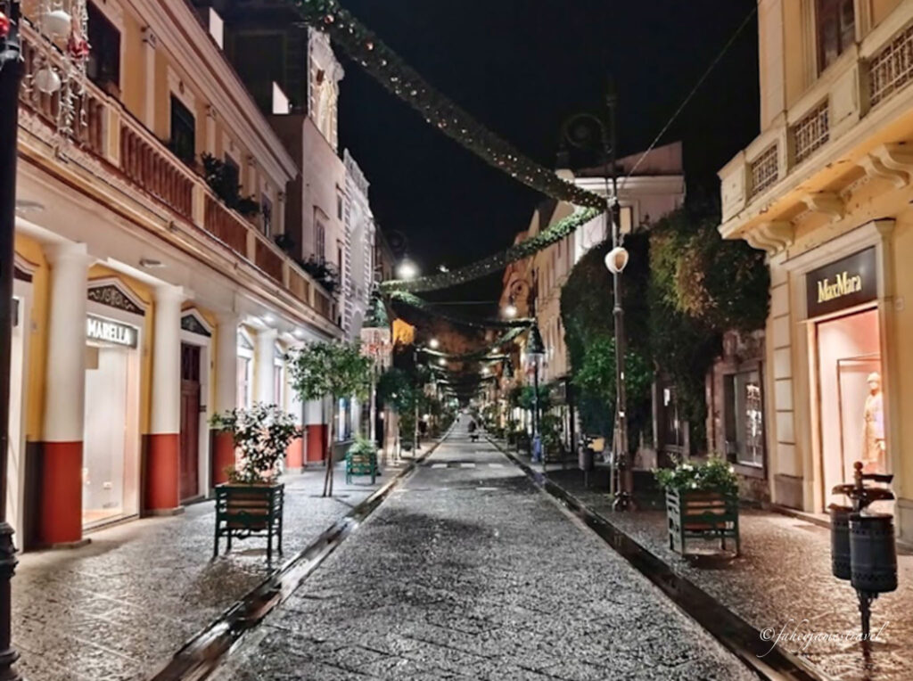 james walks through the street of sorrento in one day at night time