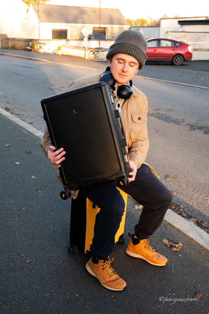 james holds the black suitcase on the level8 luggage review