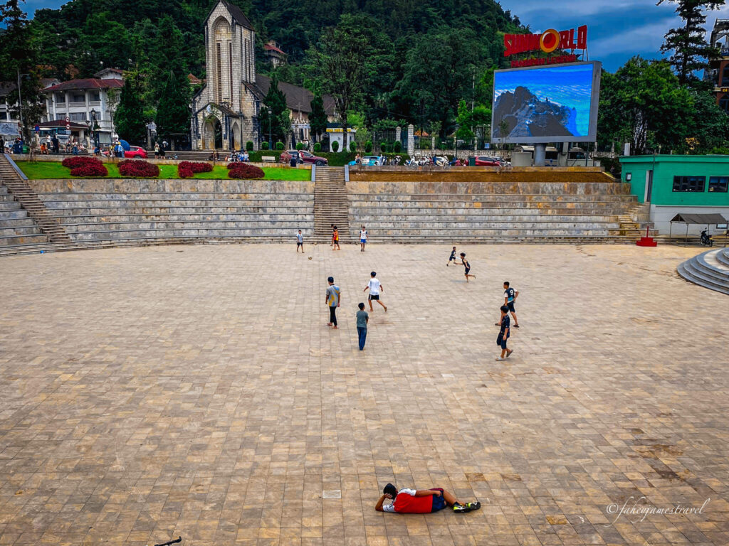 sapa square is pictured with kids playing football