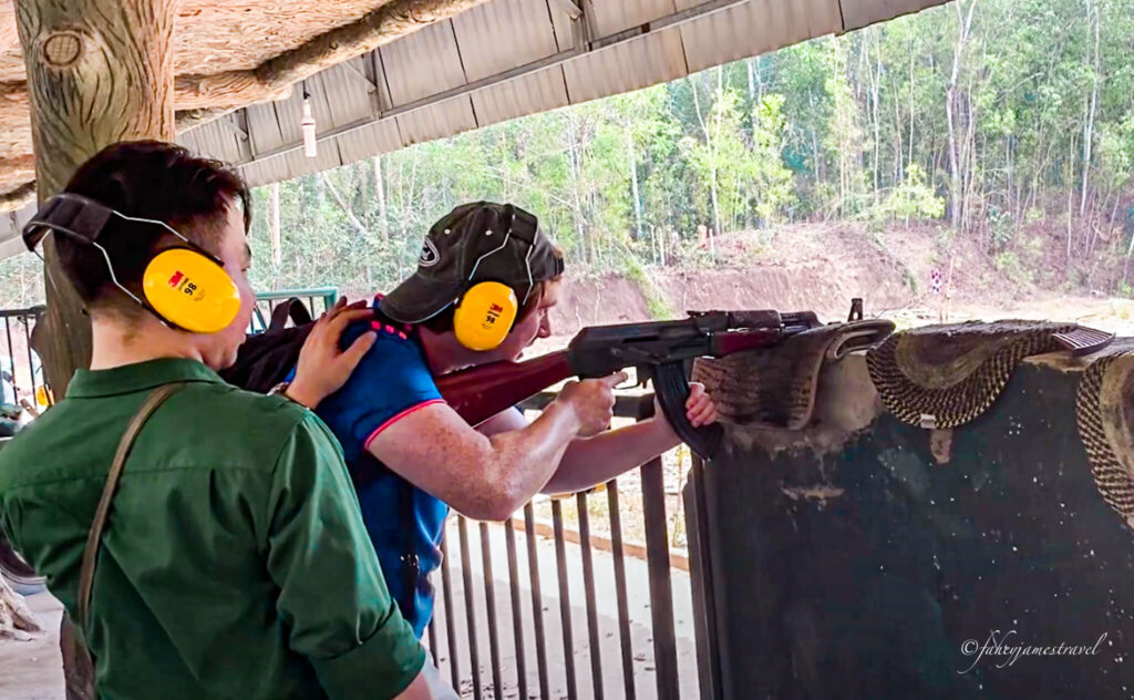 james shoots an ak47 at the cu chi tunnels in the 7 day vietnam itinerary