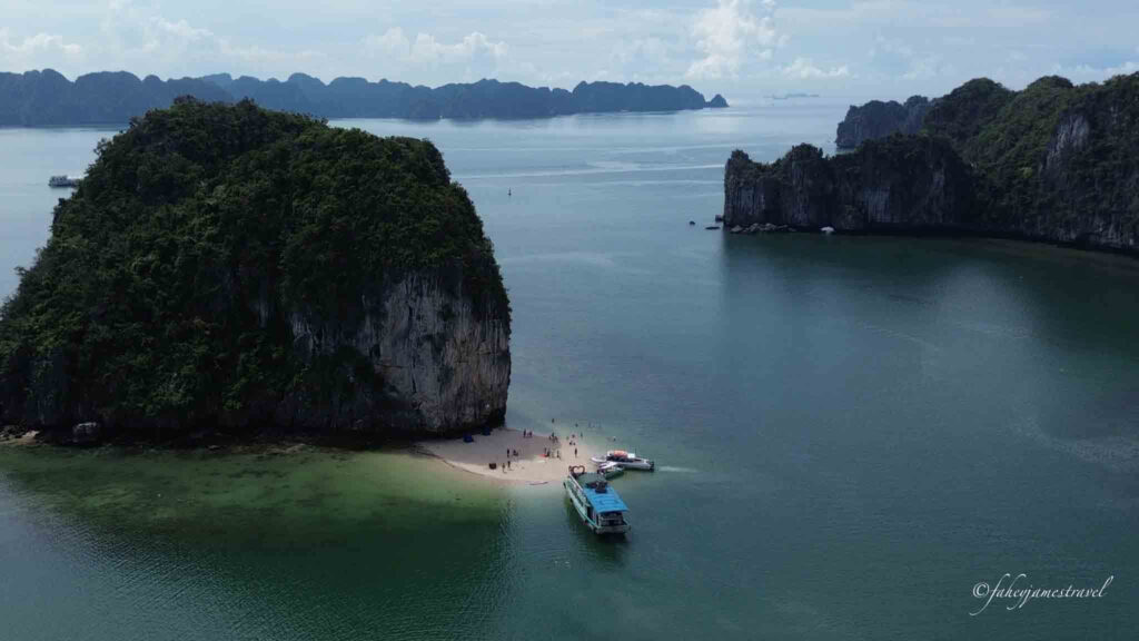 drone shot of a beach in lan ha bay close to cat ba