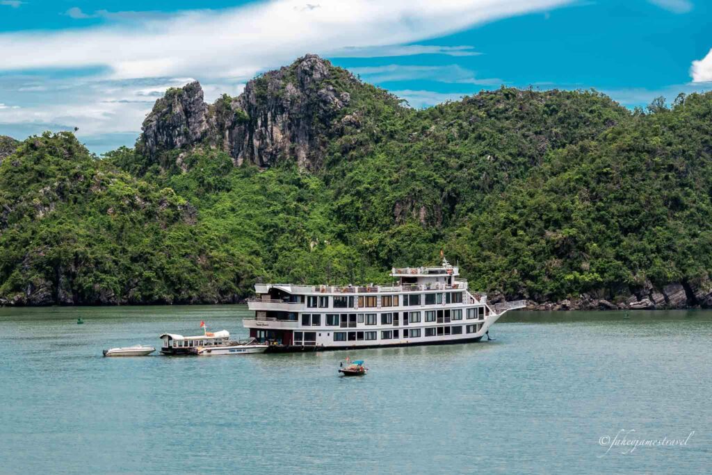 boats are pictured on cat ba island close to the floating village