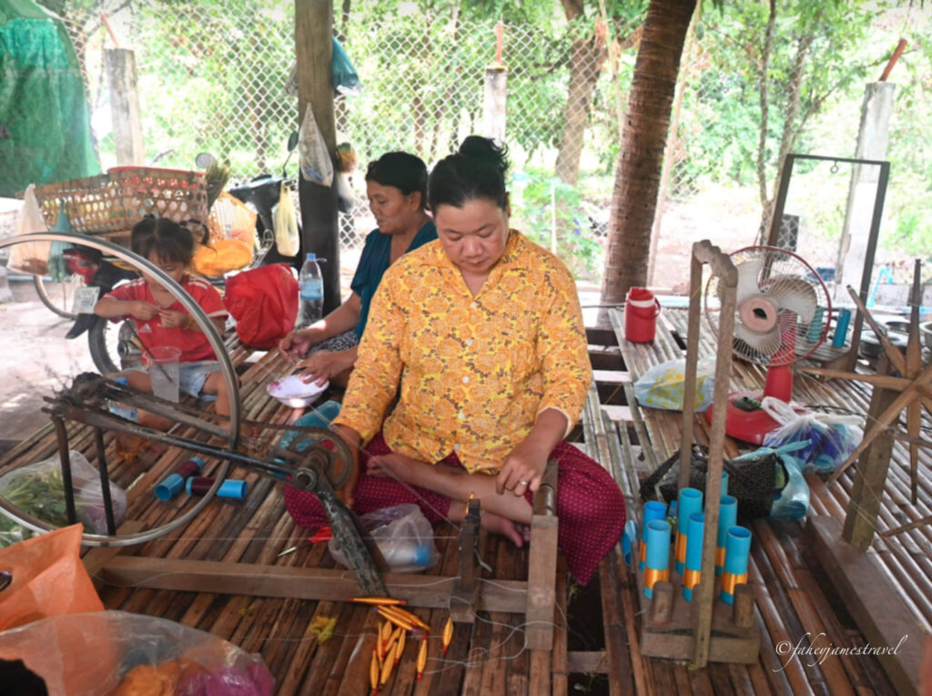 a lady spins the wheel on silk island phnomh penh
